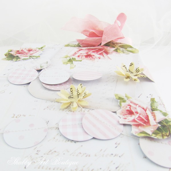 Take a gift from ordinary to extraordinary with this easy to make vintage rose punched paper garland by Shabby Art Boutique